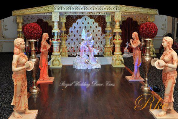 royal wedding stage with Indian mandap design for making stage in carved pilar with ganesha and task of elephant pillar in beautiful design of stage events of  wedding